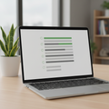 Laptop showing a clean sustainability checklist layout, plant on desk